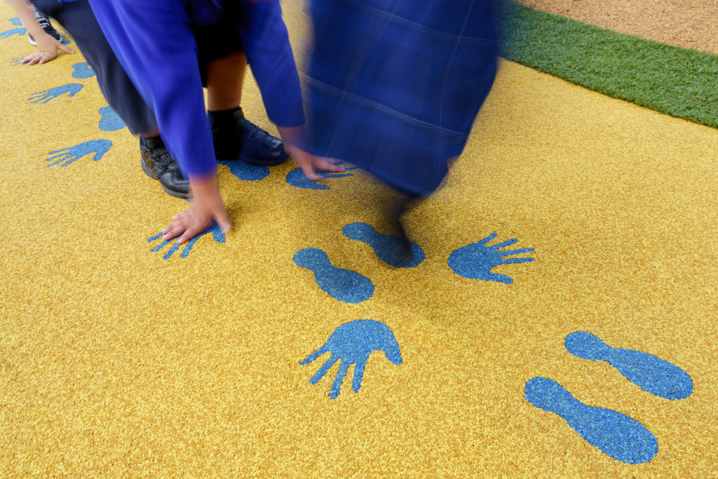 Custom safety surfacing for playgrounds